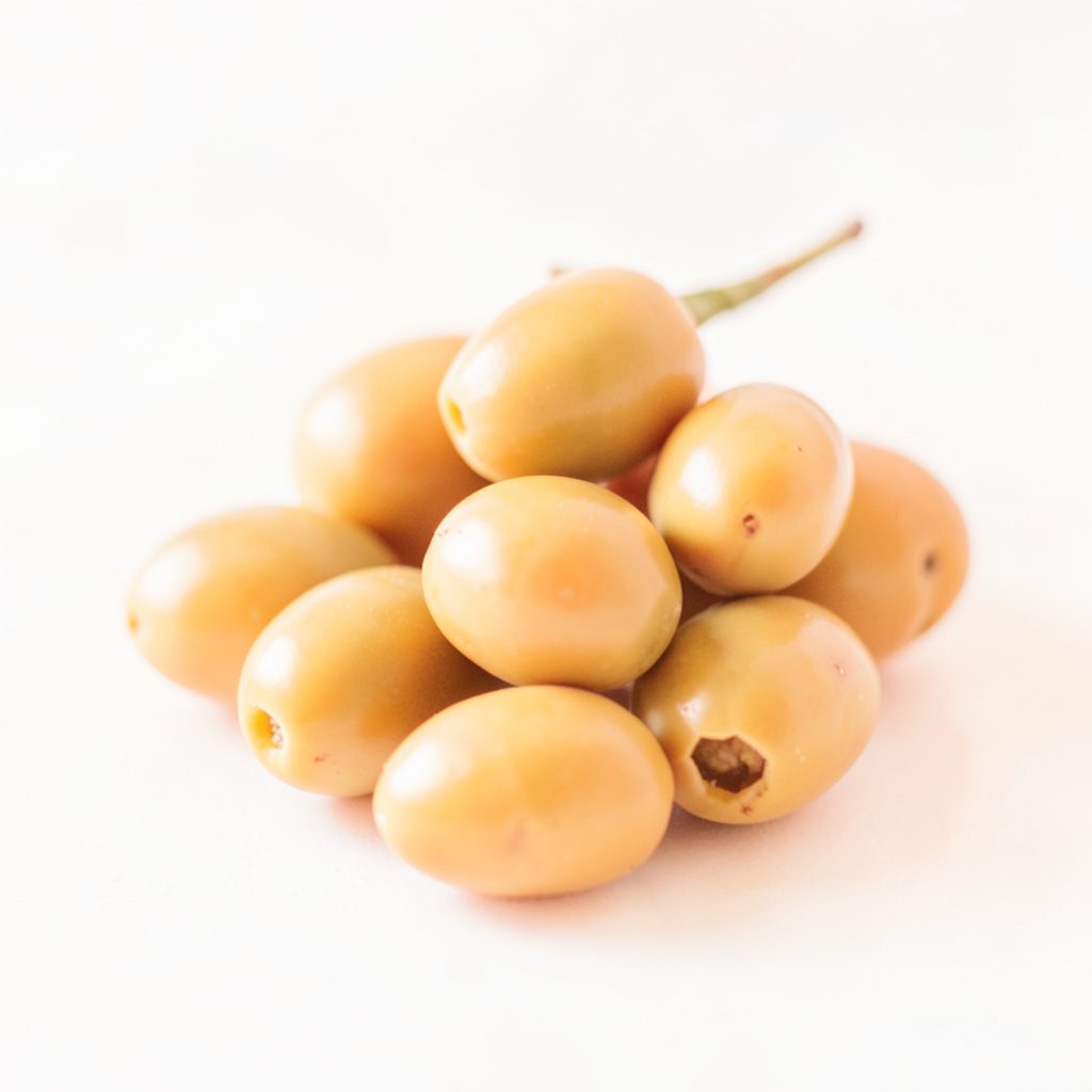 A small bowl of warm marinated olives with herbs, photographed in soft natural light